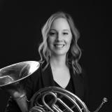 Headshot of Kiirsi Maunula Johnson with french horn